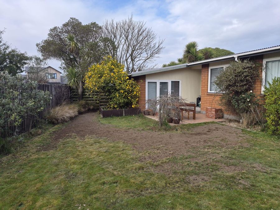 Tidy reinstatement across a back lawn after earthquake drainage repairs in Christchurch