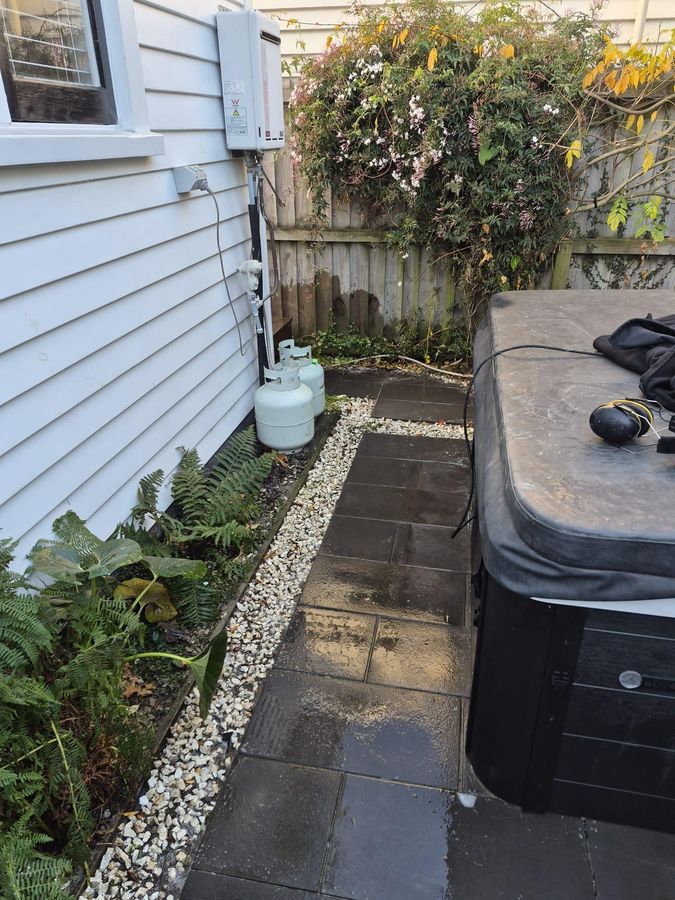 Reinstated paver path beside a Christchurch house after a drain repair