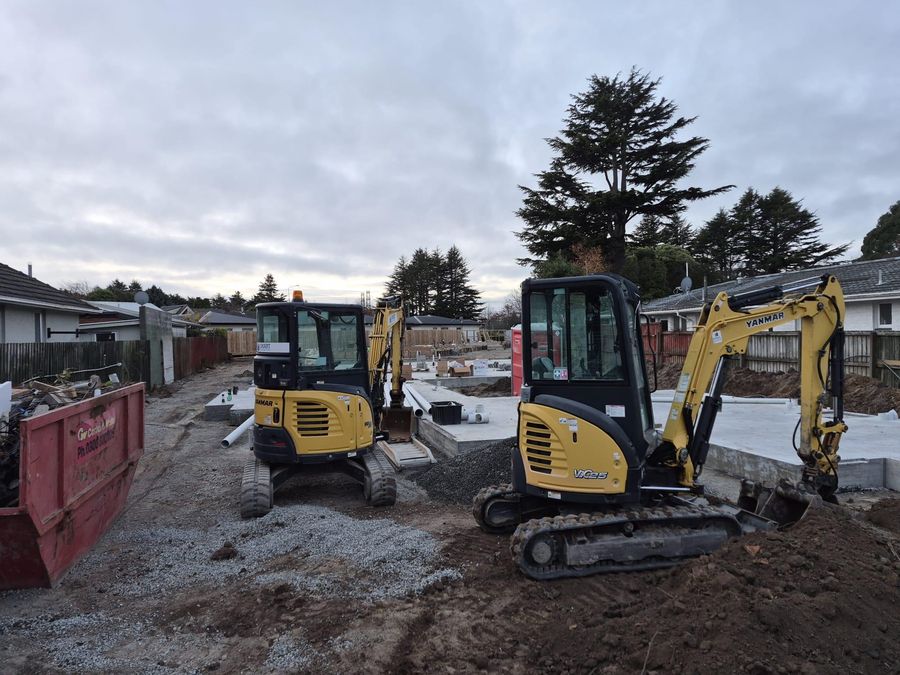 Two excavators working on a residential drainage job in Christchurch