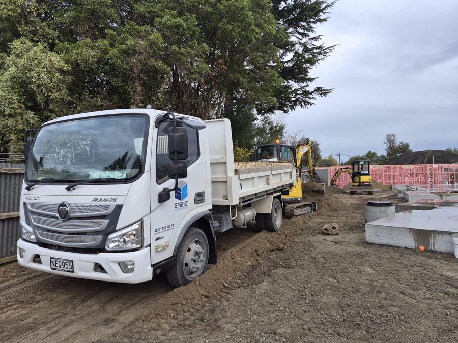 Smart Contracting tip truck on site at a Christchurch new build drainage job