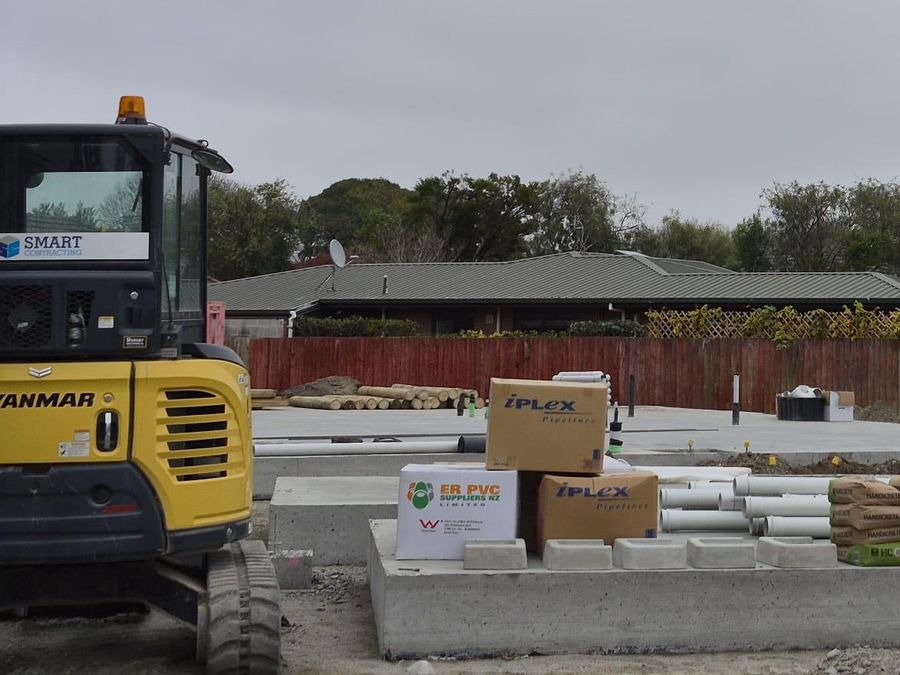 Drainage materials and concrete chambers staged on a Christchurch residential site