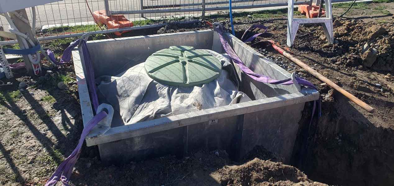 Pressure sewer pipework connected to the tank on a Christchurch install