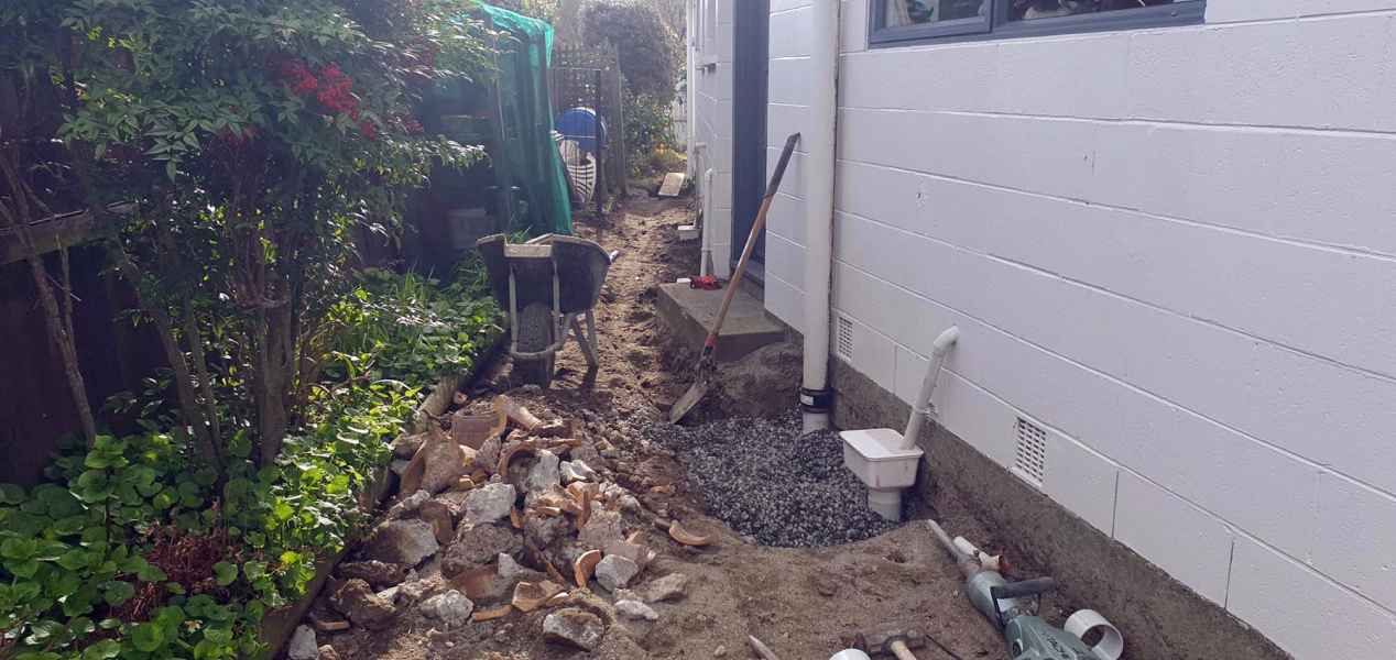 Drainage trench dug alongside a Christchurch house