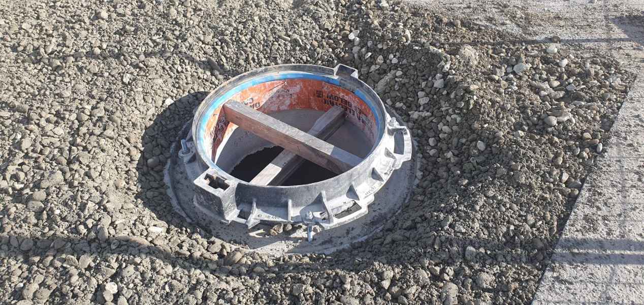 Manhole collar being set into a commercial hardstand in Christchurch