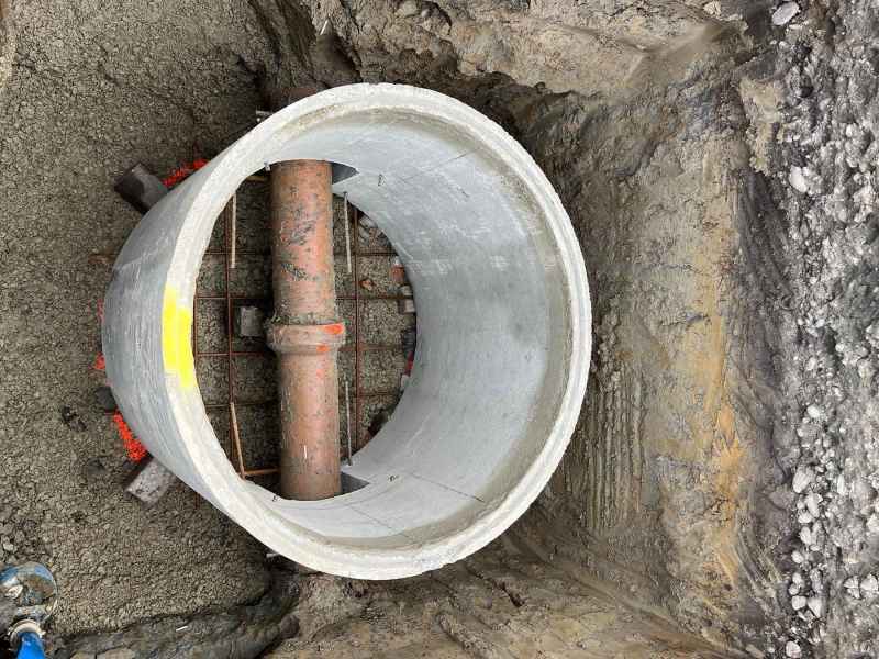 Large concrete manhole base set over a drainage line in Christchurch