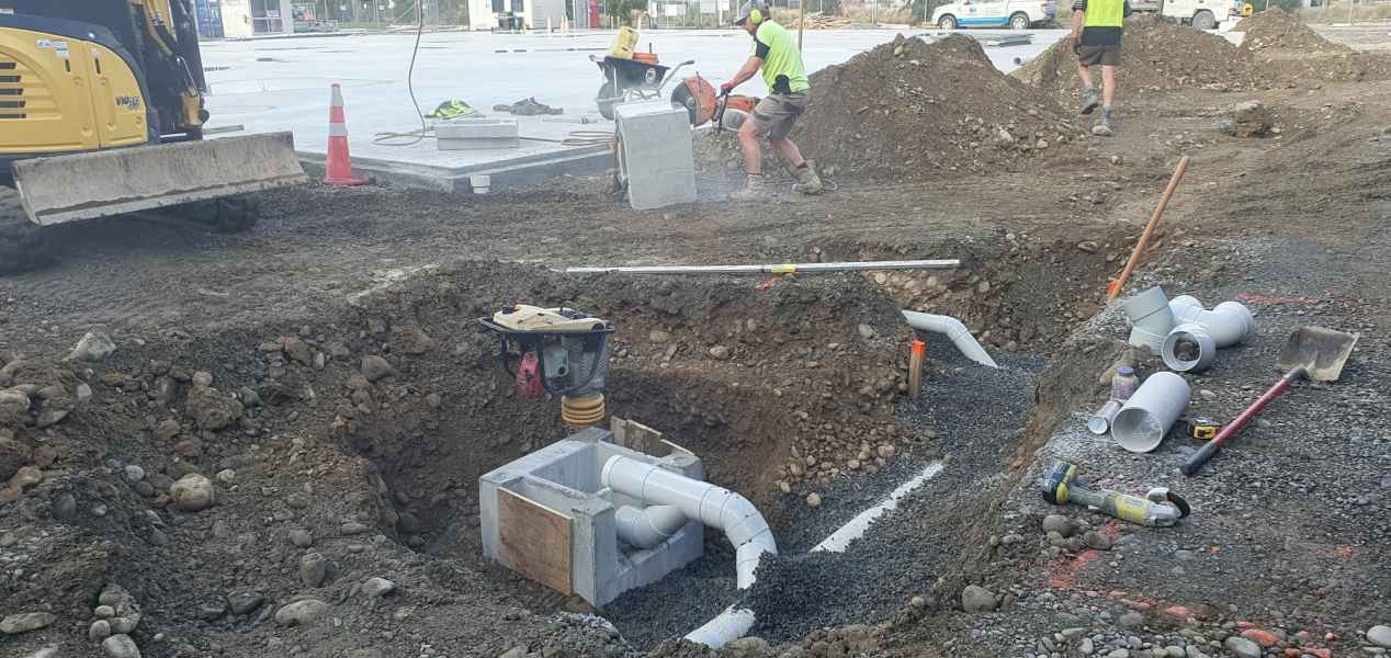 Commercial drainage chamber and pipework being installed in Rolleston