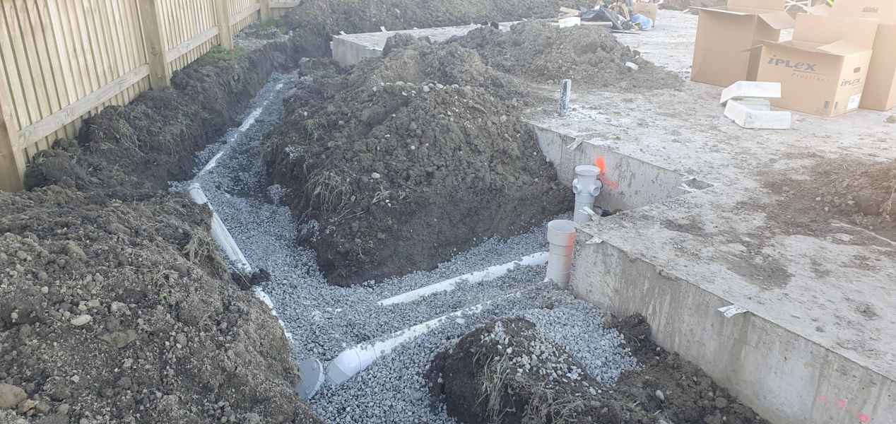 Drainage lines bedded in gravel around a new house slab in Christchurch