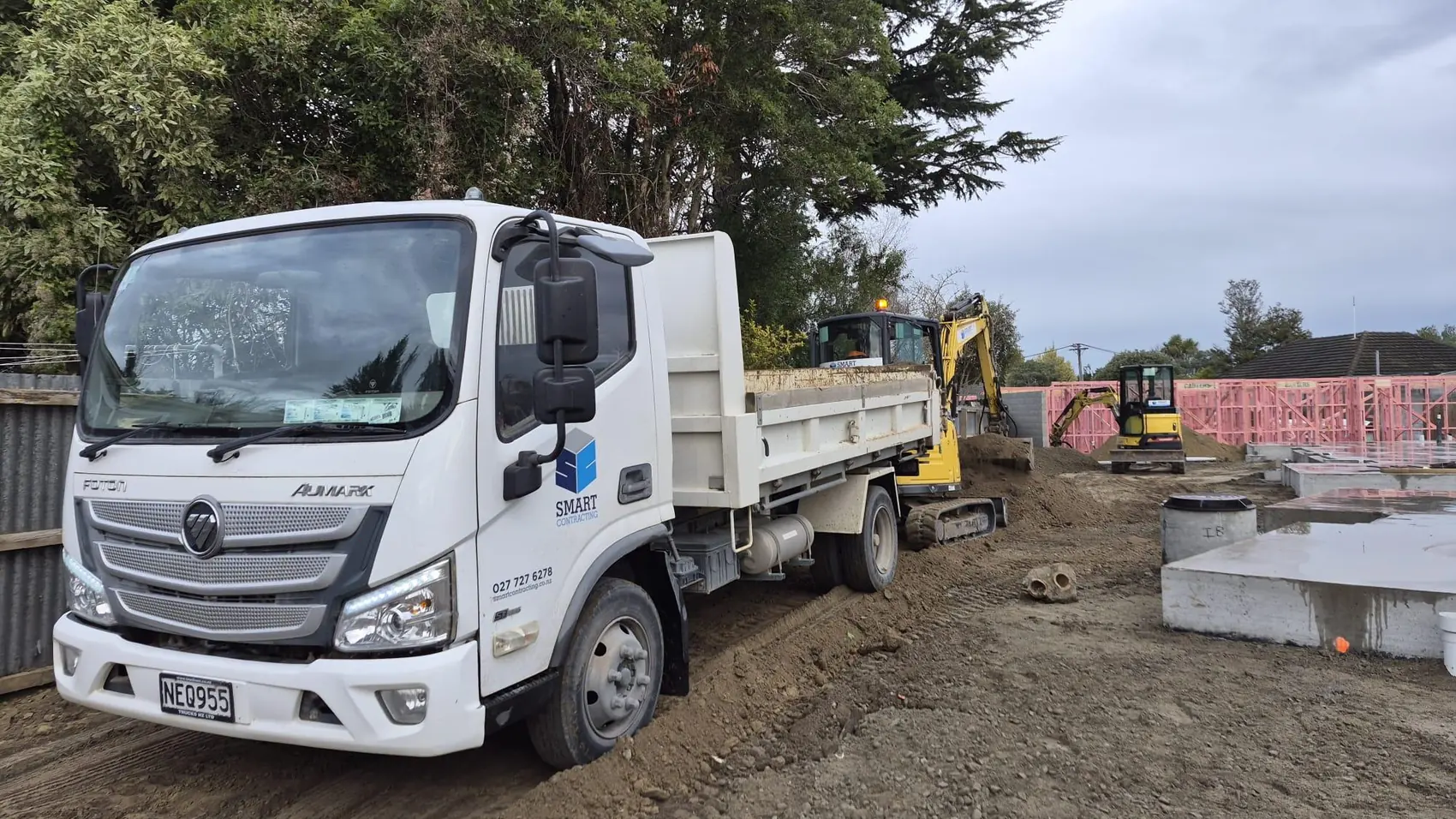 Smart Contracting tip truck and excavators on a Christchurch new build drainage job